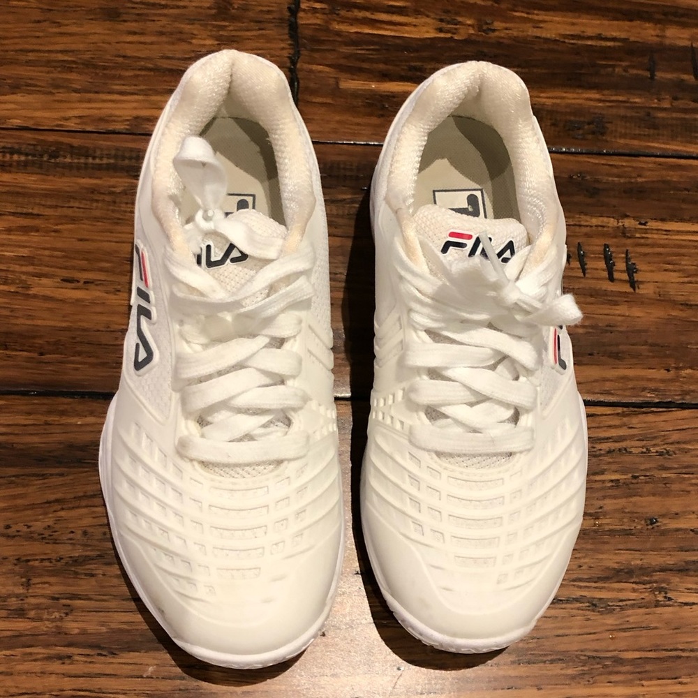 Brand new Fila shies in white. Size: 6.5 US. Only worn once!